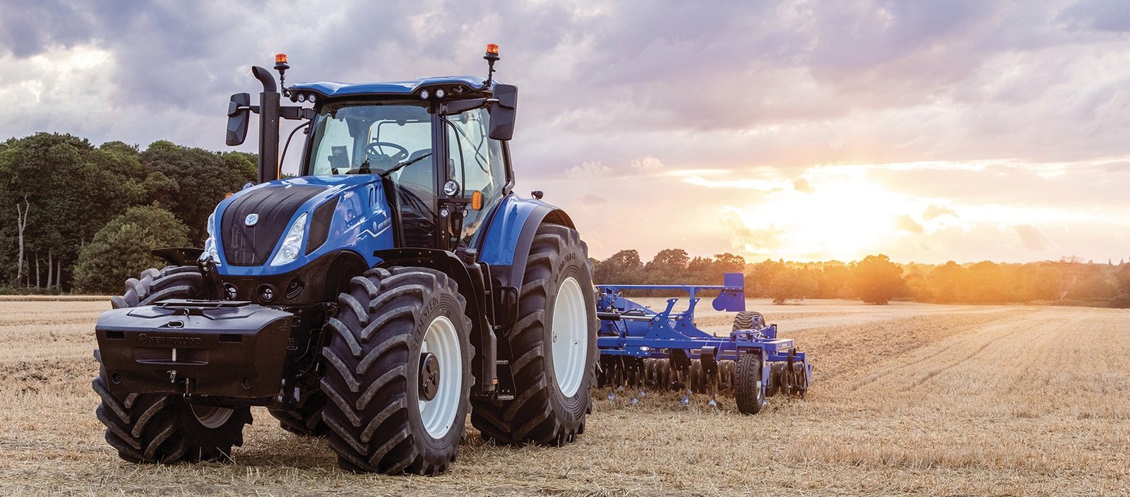 Tractor and harvesting equipment in the field
